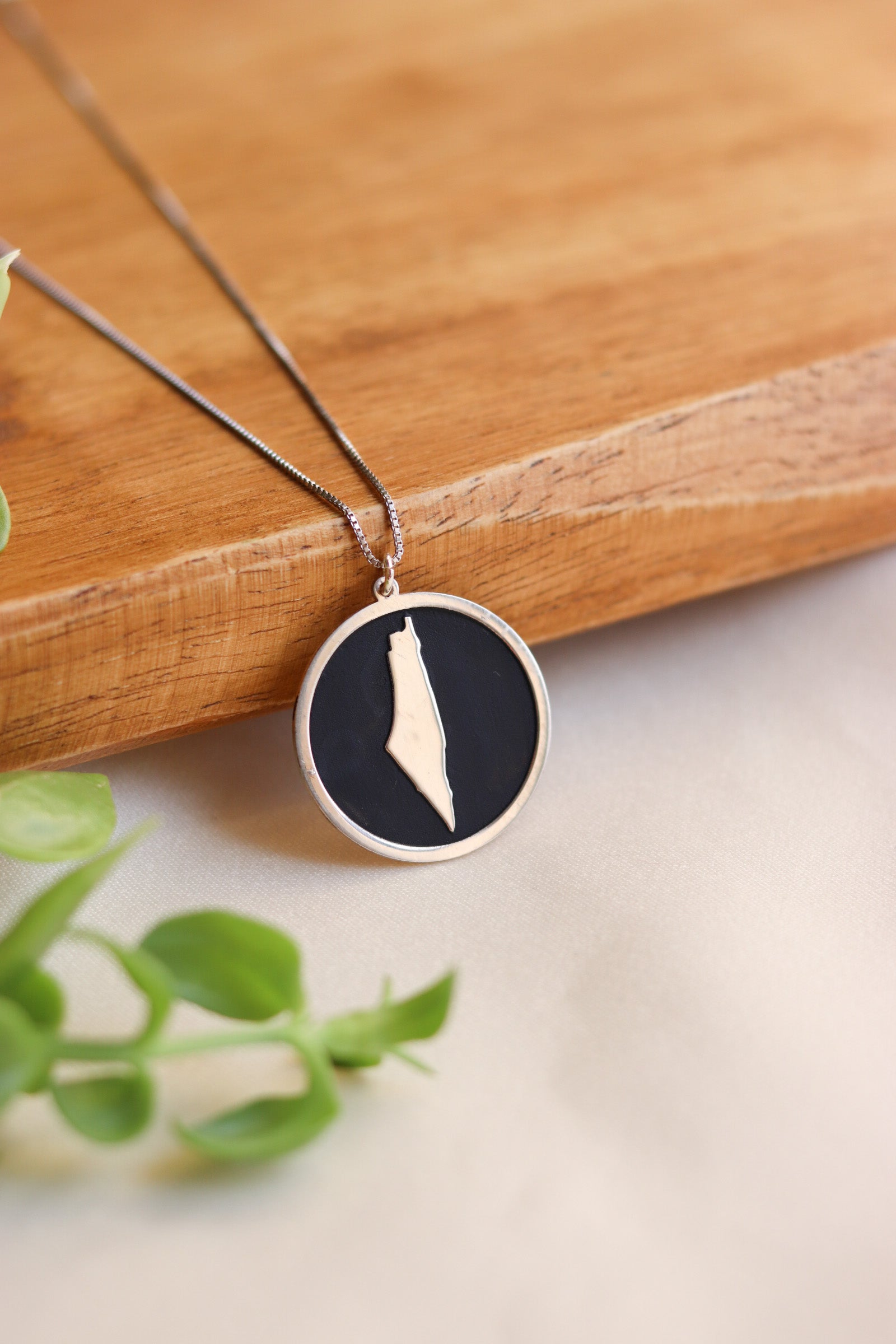 Black plate with Palestine map inside necklace
